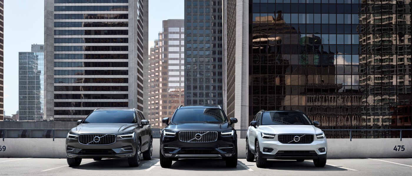 2020 Volvo SUV line up parked ontop of parking garage in the city