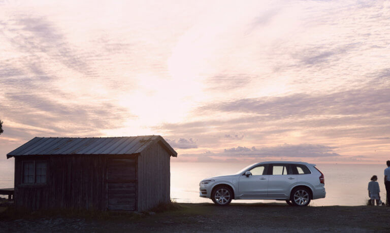 2020 Volvo XC90 side view park infront of a lake during sunset