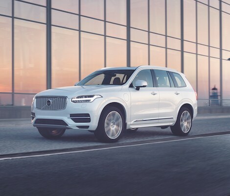 2019 Vovlo XC90 A white 2019 Volvo XC90 driving past an all window building