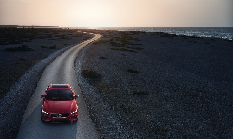 Red 2019 Volvo S60 on road