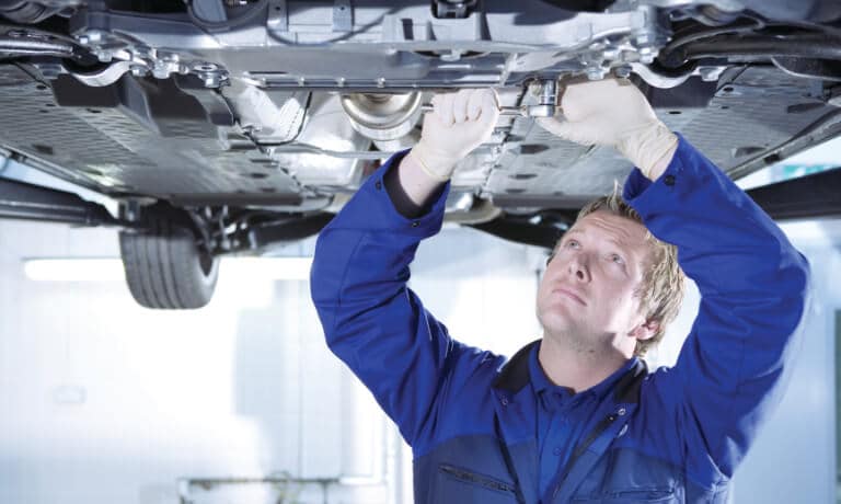 Mechanic Working on a lifted vehicle