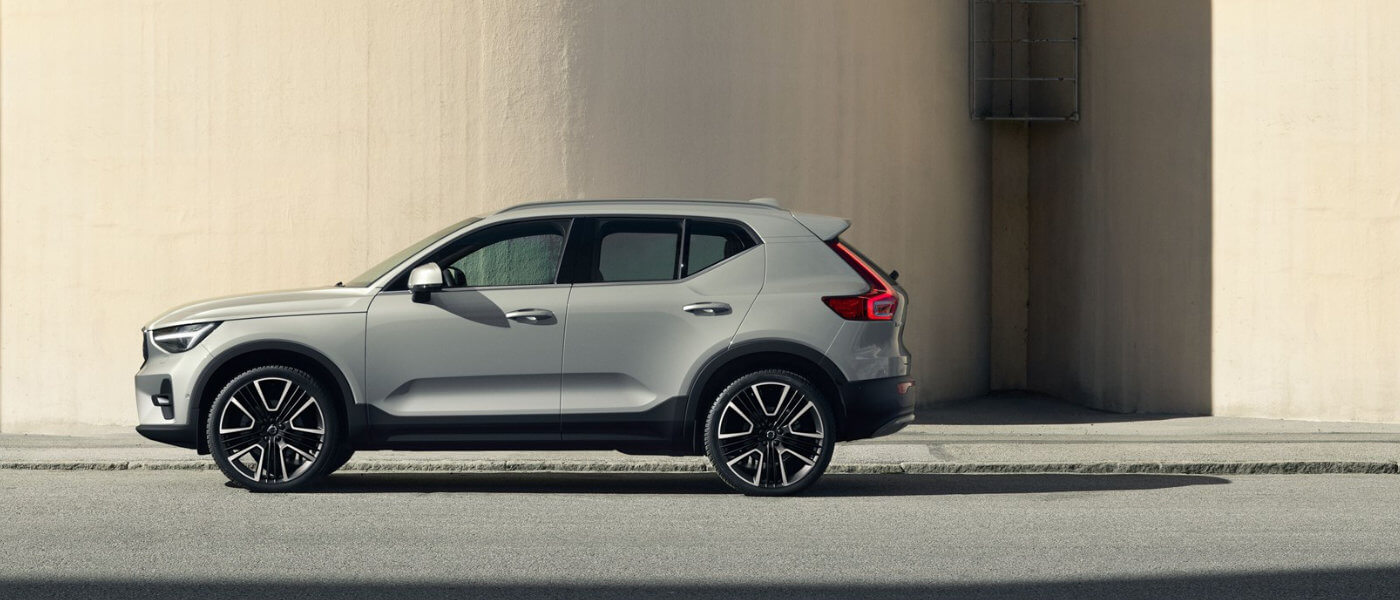 2026 Volvo XC40 side view near silo in sun