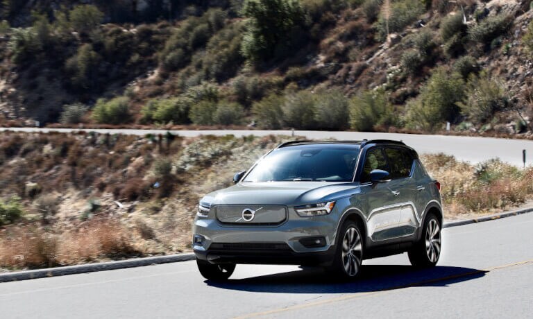 Volvo XC40 Recharge driving on a mountain road