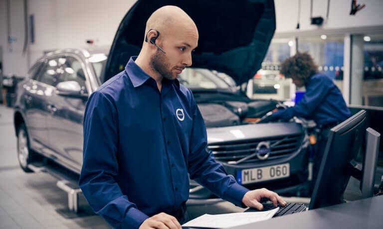Volvo technician checking a computer