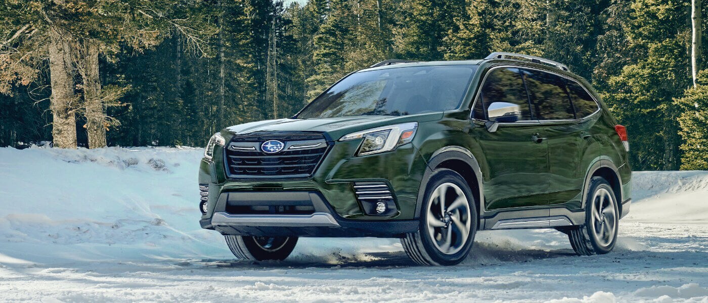 2022 Subaru Forester parked in a snowy forest