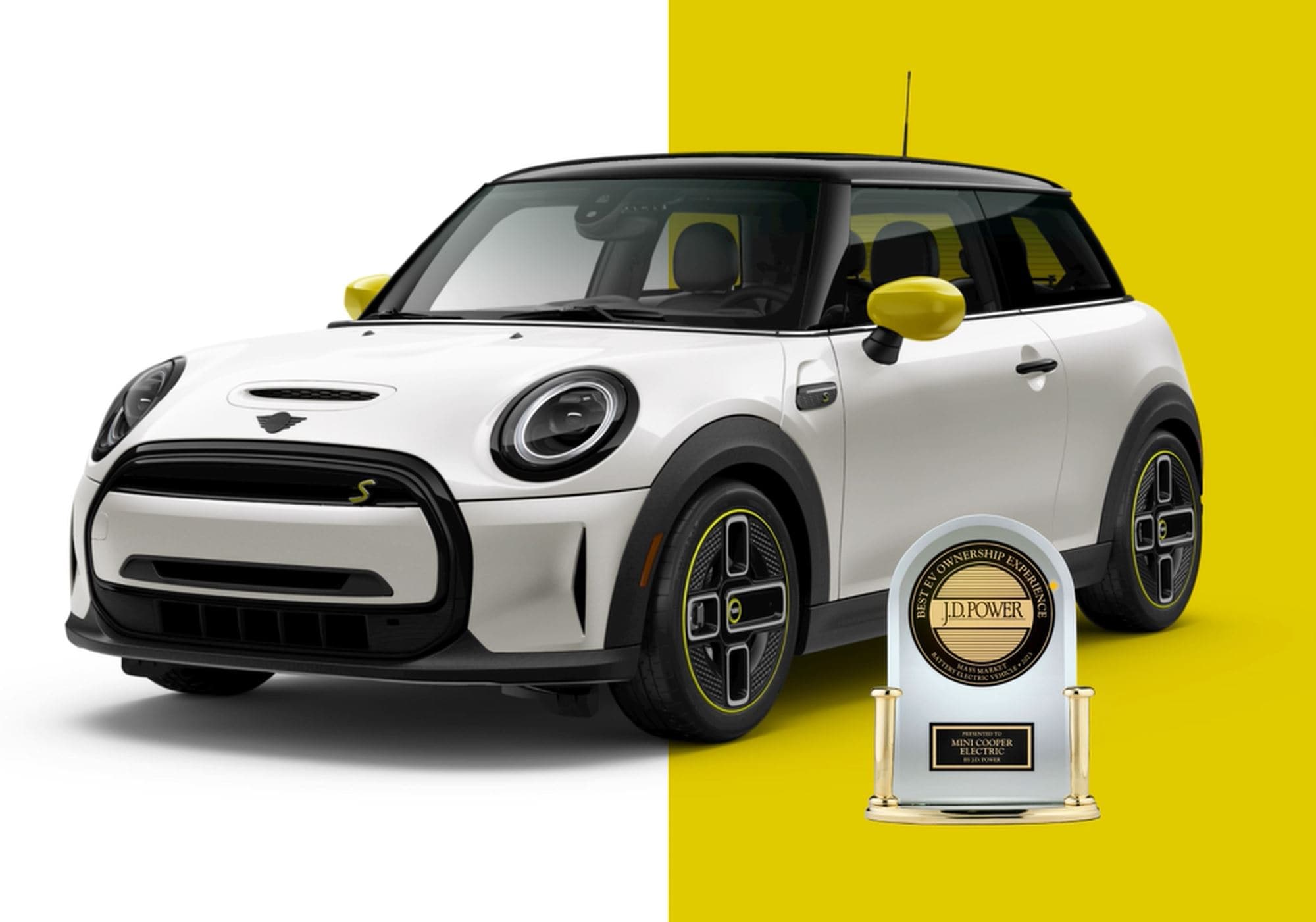 Frontside view of MINI Electric with white and gold background and J.D. Power Award below driver door.