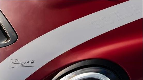 3.Alt TextA close up of the white bonnet stripe embossed with the 33EJB number plate and Paddy Hopkirk signature.jpg