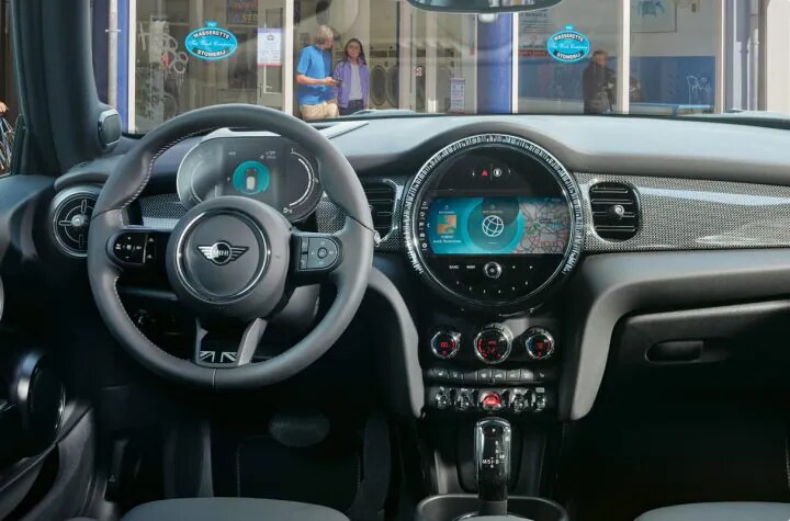 A view of the updated steering wheel, dashboard, and radio of the MINI Hardtop.