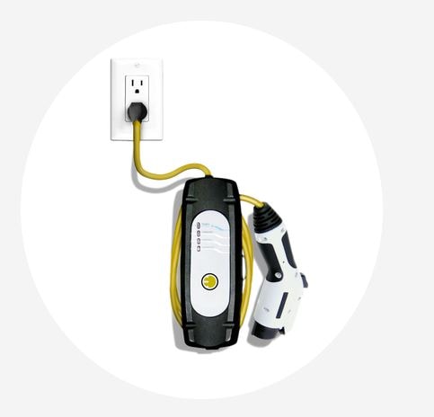 MINI Electric Occasional Use Charger plugged into a power outlet in front of an oval white background