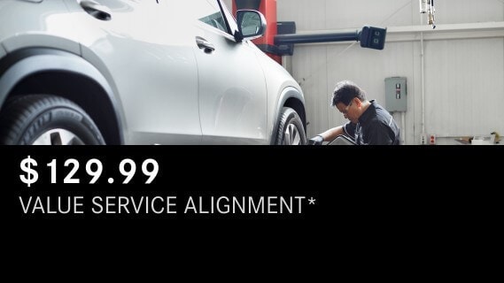 Learn about the Mercedes-Benz Value Service Alignment package Mercedes-Benz Value Service Alignment showing a technician working on a wheel of a Mercedes-Benz vehicle