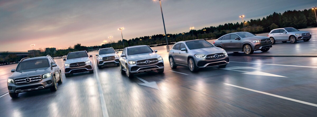Lineup of pre-owned Mercedes-Benz vehicles outside