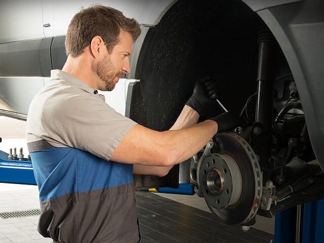 Mercedes-Benz Van Service Technician servicing a Mercedes-Benz van