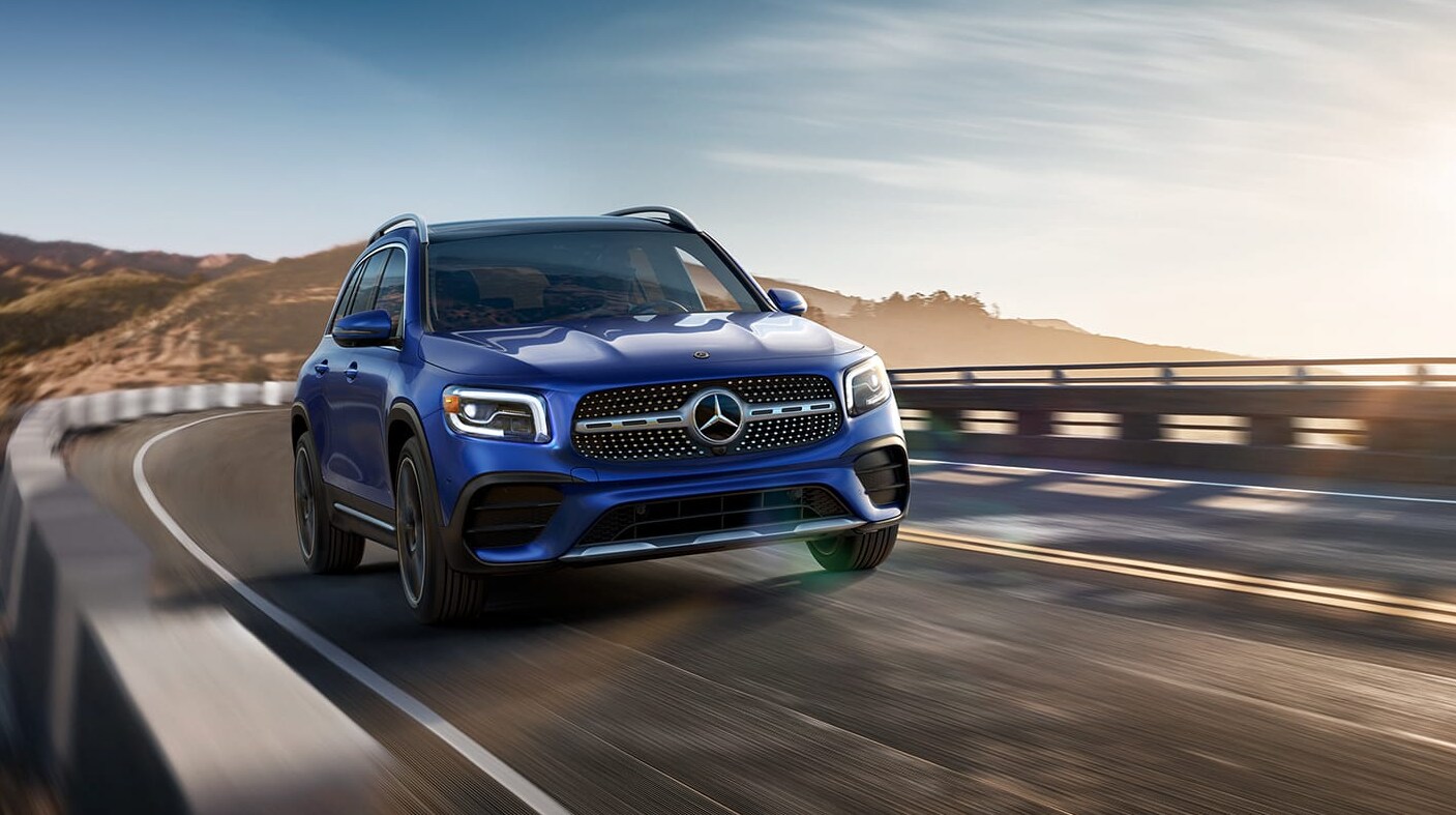 2022-Mercedes-Benz-GLB-01.PNG A Blue 2022 Mercades-Benz GLB in motion driving on the highway