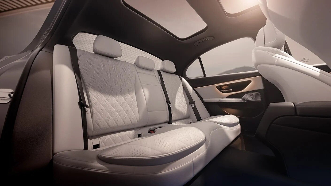 2025-E-SEDAN-GAL-022-Q-FI-DR.jpeg The seating in the back of a Mercedes-Benz E-Class vehicle.