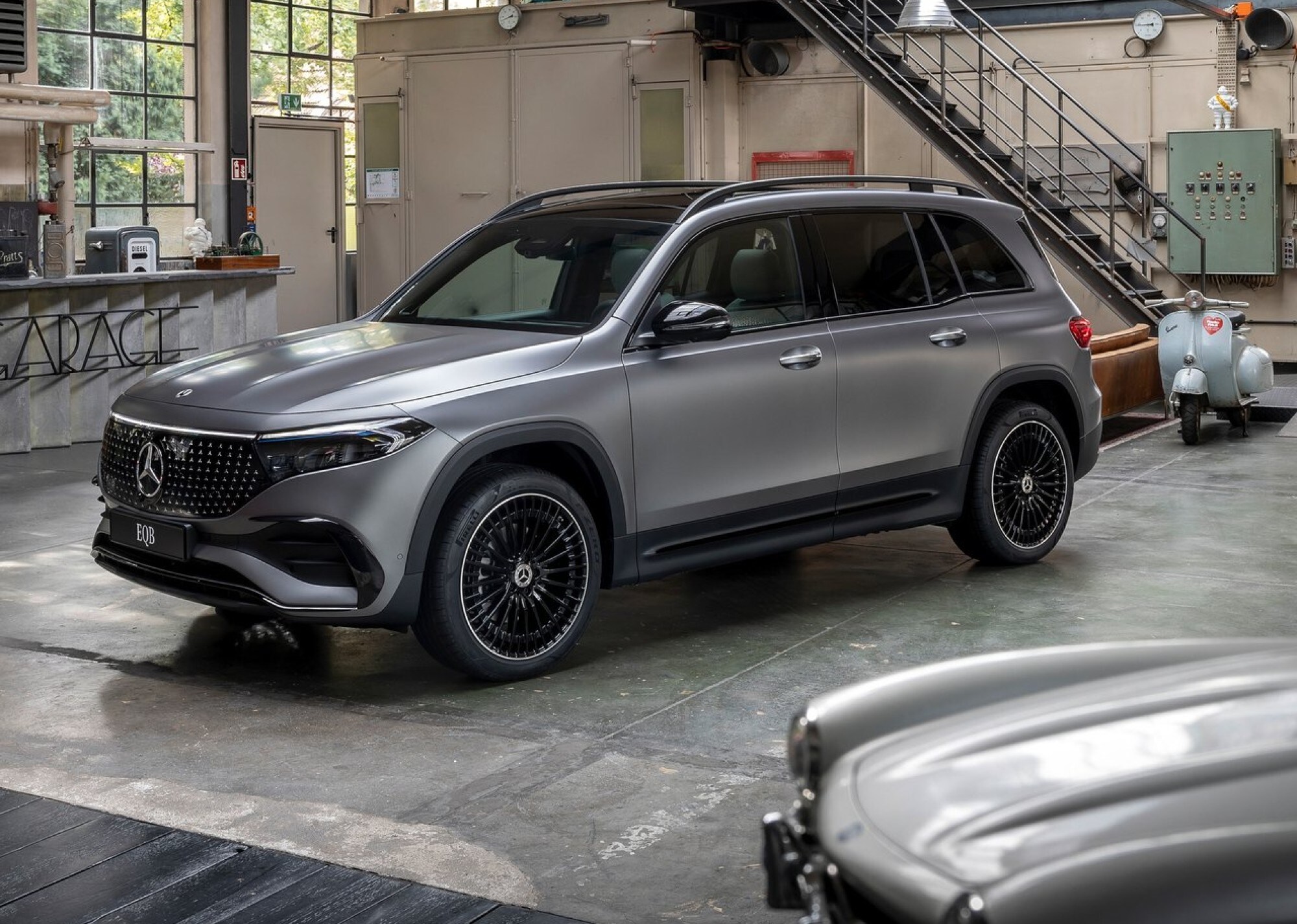 Mercedes-Benz-EQB-2024-1280-01%20(1).jpg A 2024 Mercedes-Benz-EQB parked inside of a modern garage.