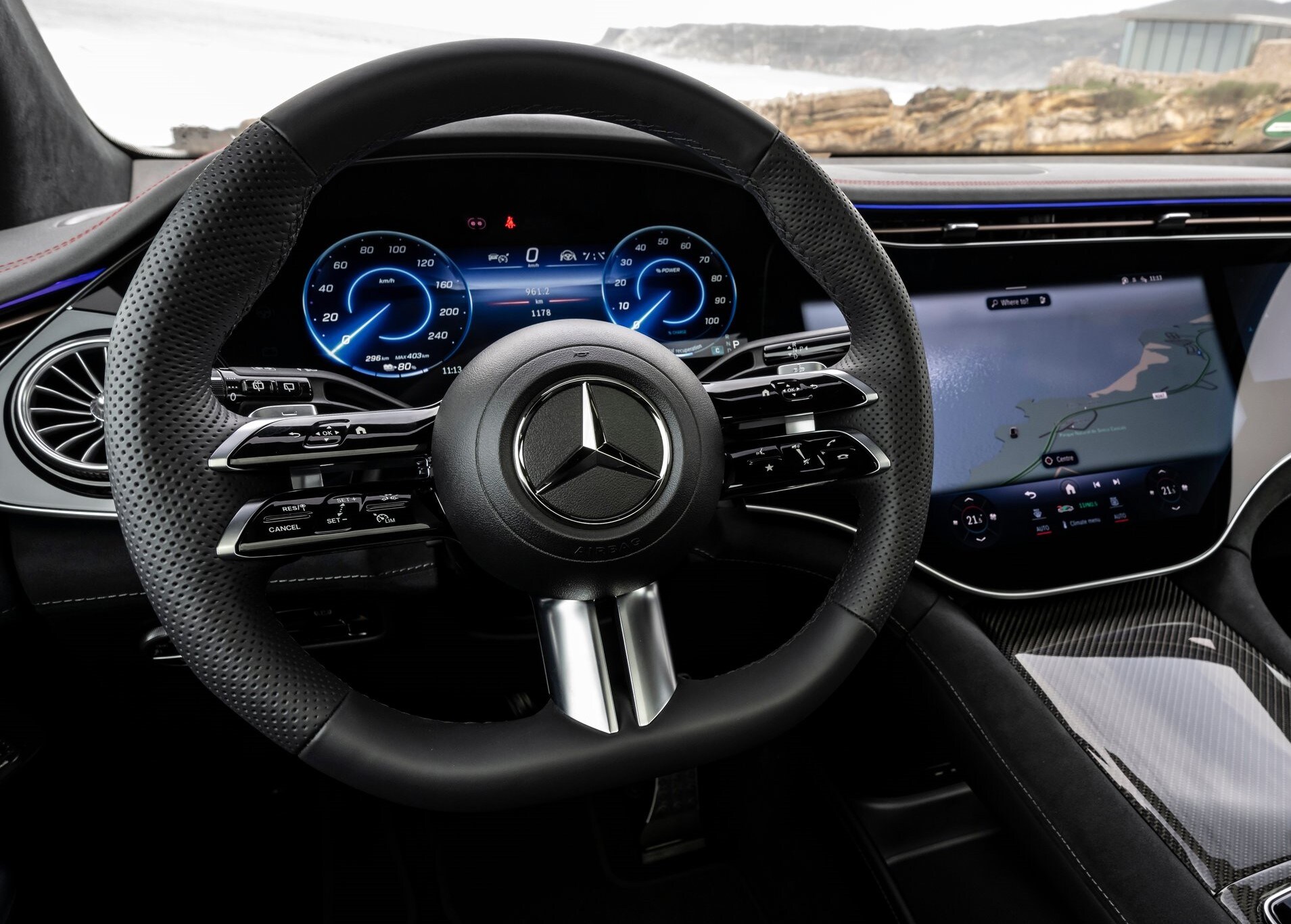 Mercedes-Benz-EQE_SUV-2024-HD-d516e7181b76ec3c2fc9c662d725ea1eddab6f6c3.jpg A view of the dashboard inside a 2025 Mercedes-Benz EQE.