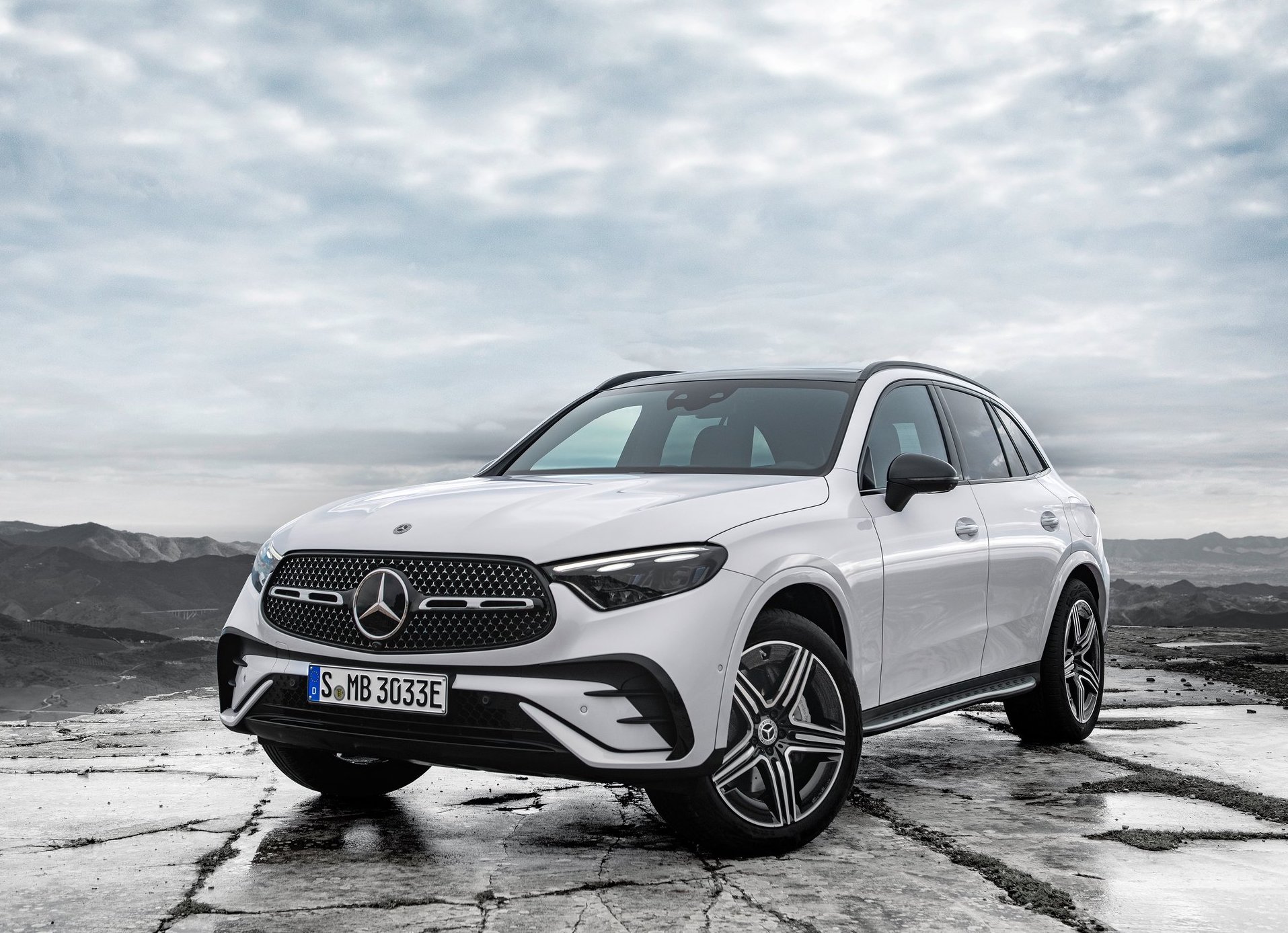Mercedes-Benz-GLC-2023-HD-80d1bb341b8544d748689366c6da81ba4a4f494aa.jpg A Mercedes-Benz GLC parked on a high overlook