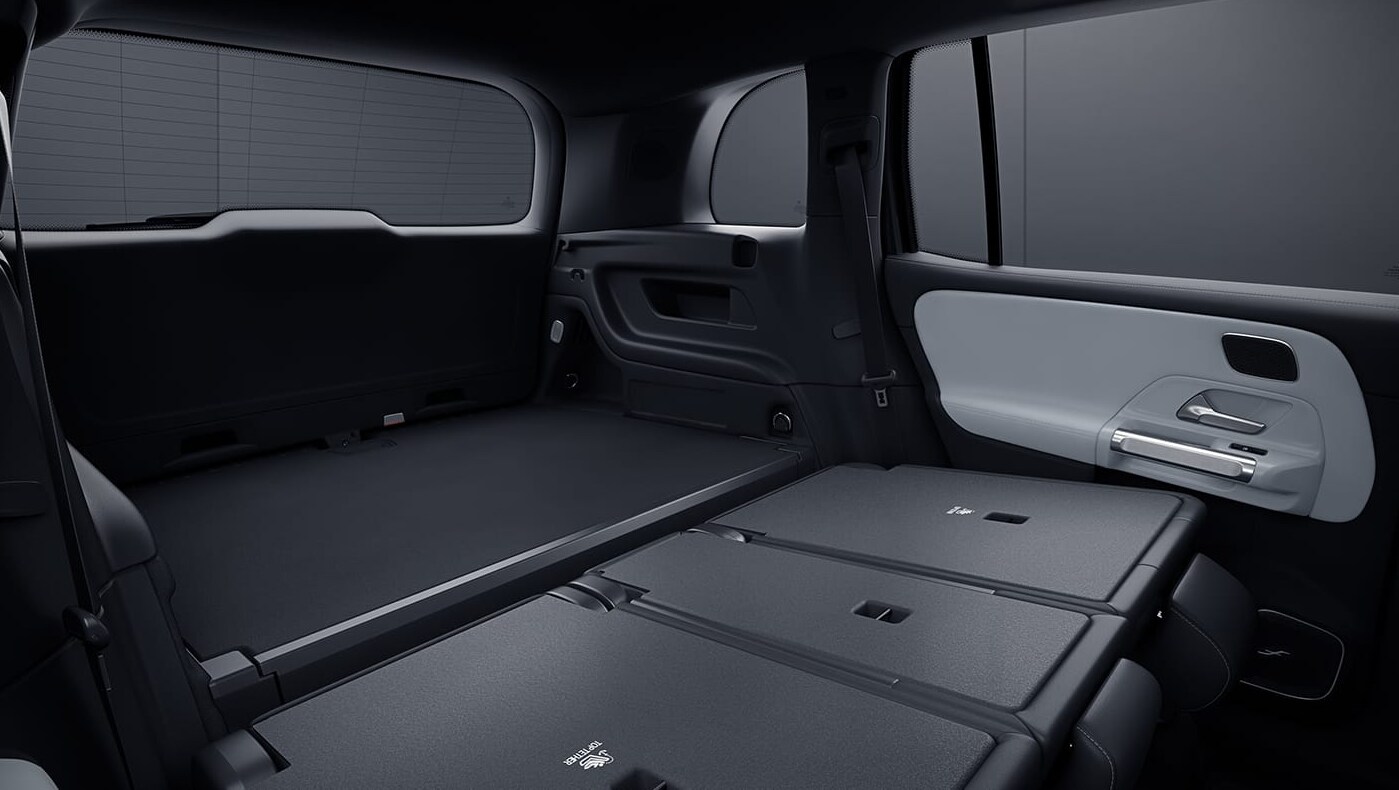 2022-Mercedes-Benz-GLB-03.PNG The interior of a Mercedes-Benz GLB showing the backseat and trunk full of cargo space