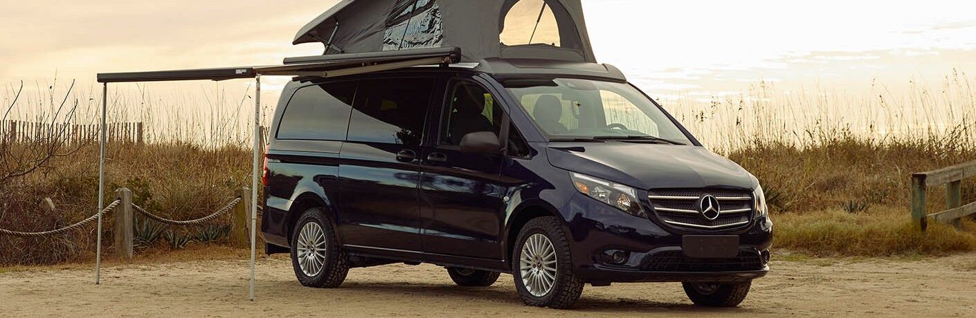 2020_MB_Metris_Van_parked_on_beach_with_camping_tent_on_roof_o.jpg