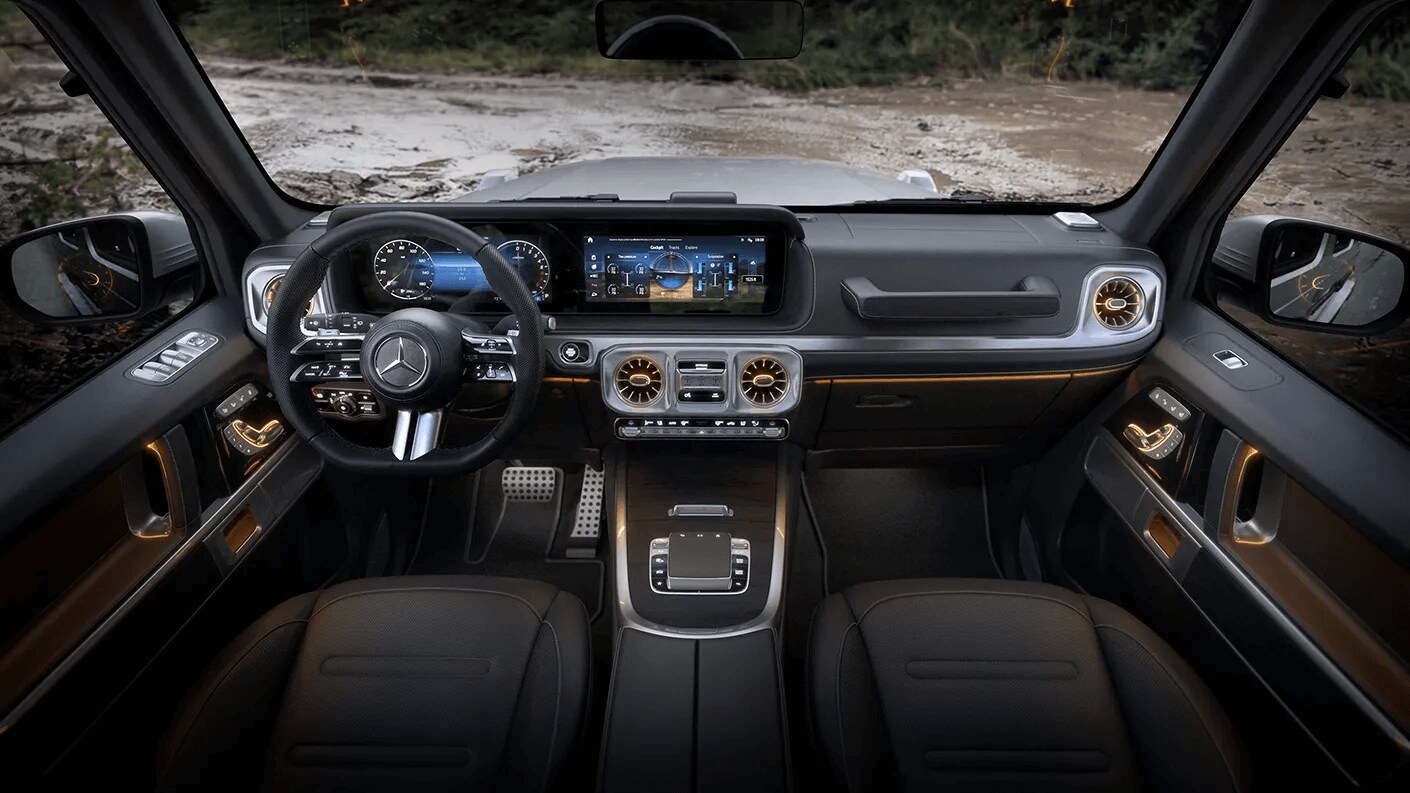 Learn about the seating and cargo capacity of the Mercedes-Benz GLA SUV Rendered image of the front row of the Mercedes-Benz G-Class SUV showing the steering wheel and dashboard console