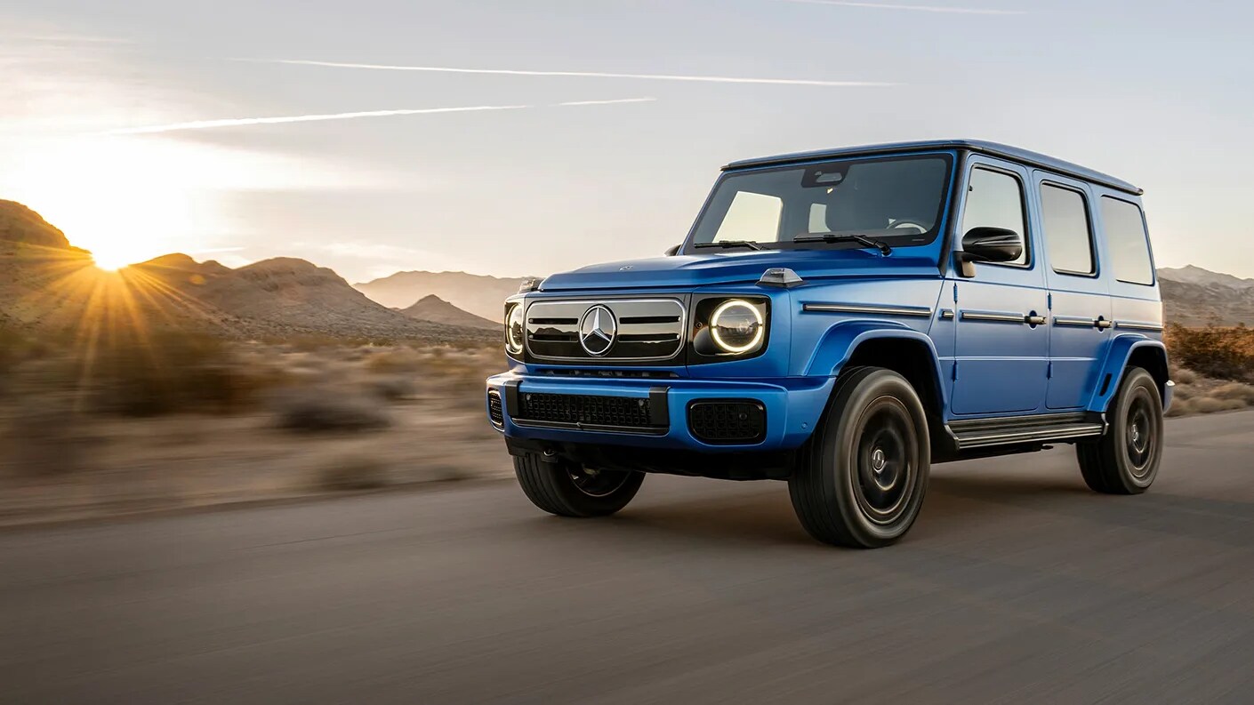 Mercedes-Benz G-Class with 4MATIC An image of a Mercedes-Benz G-Class driving on a dirt road
