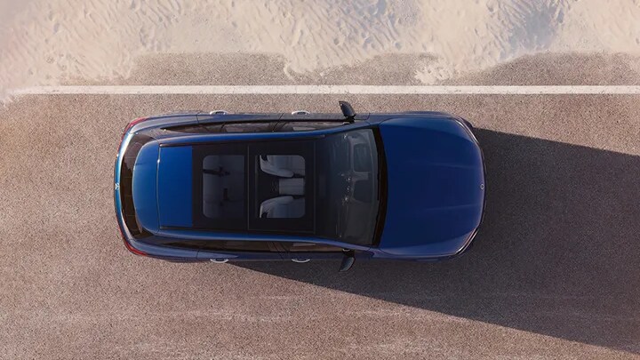 Mercedes-Benz with 4MATIC An overhead image of a Mercedes-Benz GLC driving on a dirt road
