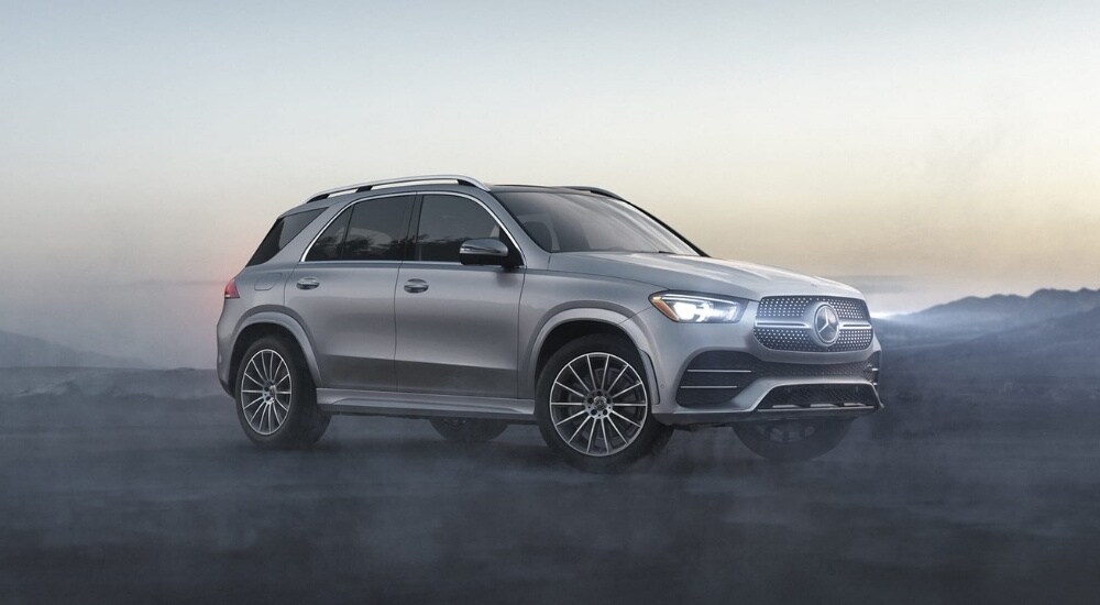 2020%20Mercedes-Benz%20GLE%20-%20Fog%202.jpg Side angled view of a grey 2020 Mercedes-Benz GLE parked off-road.