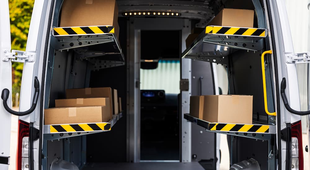 Mercedes-Benz%20Sprinter%204500%20for%20Sale%20in%20Medford%20-%202025%20Mercedes%20Sprinter%204500%20-%20Delivery.jpg The back of a white 2025 Mercedes-Benz Sprinter 4500 full of packages for delivery.