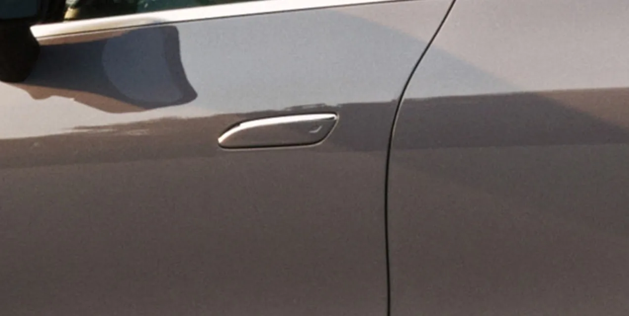Flush door handle on the side of a silver GLC Electric SUV