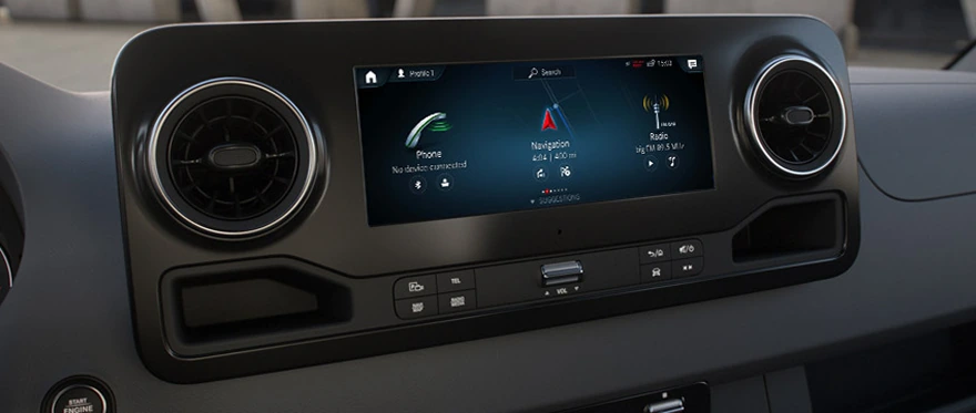 Sprinter dashboard at night with the instrument cluster and centre display lit