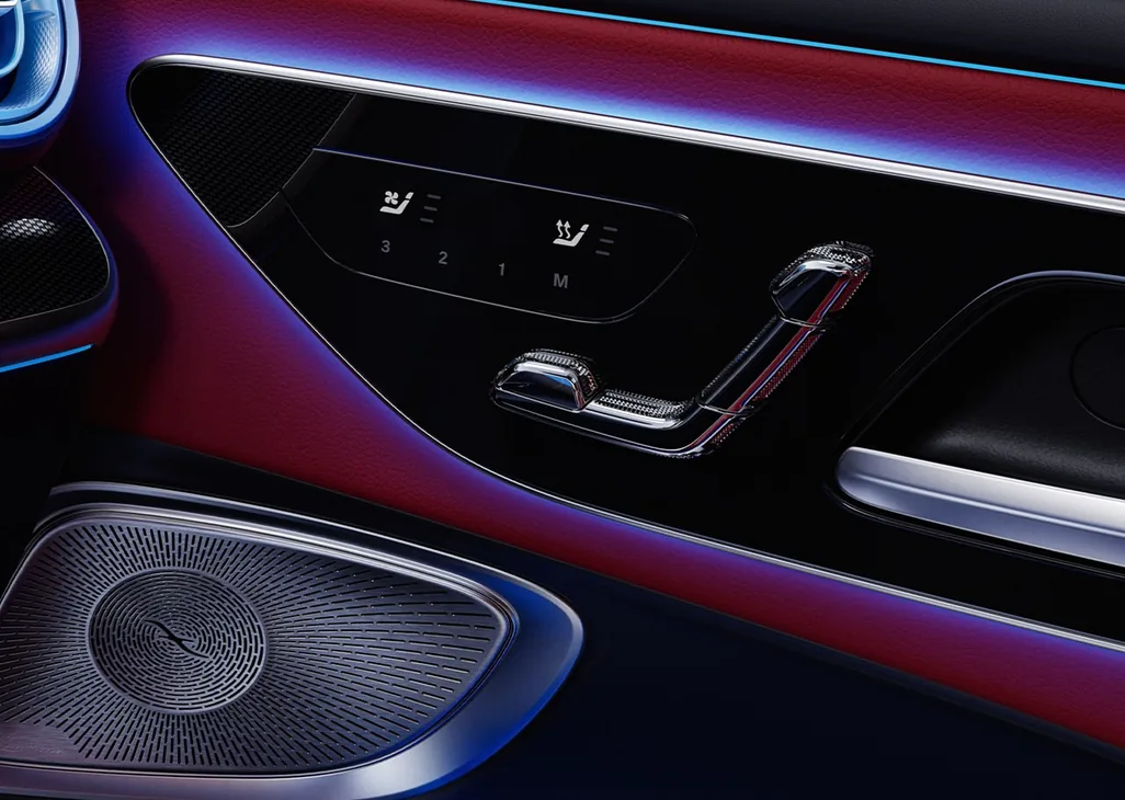 CLE door panel with seat-shaped controls, memory buttons and a Burmester speaker grille