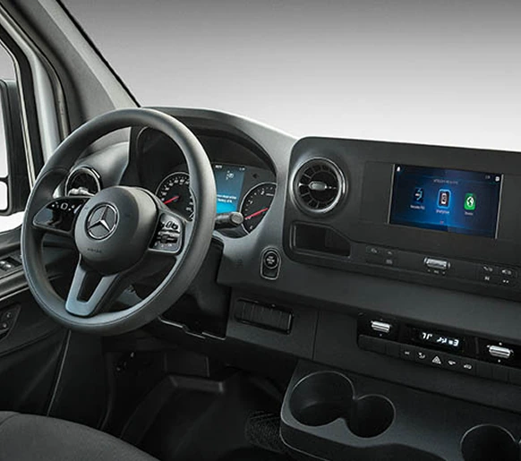 Sprinter driver's view of the steering wheel, instrument cluster and centre touchscreen