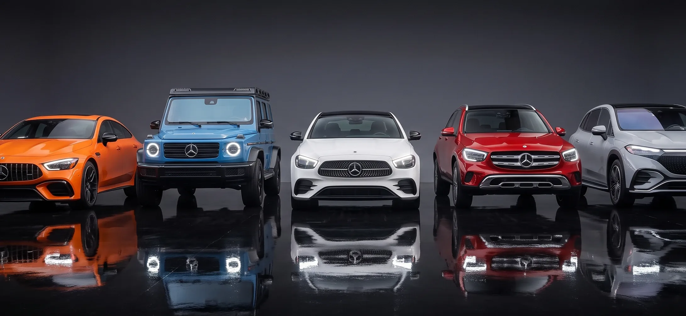 Row of Mercedes-Benz models reflected on a dark showroom floor, used as a darkened backdrop
