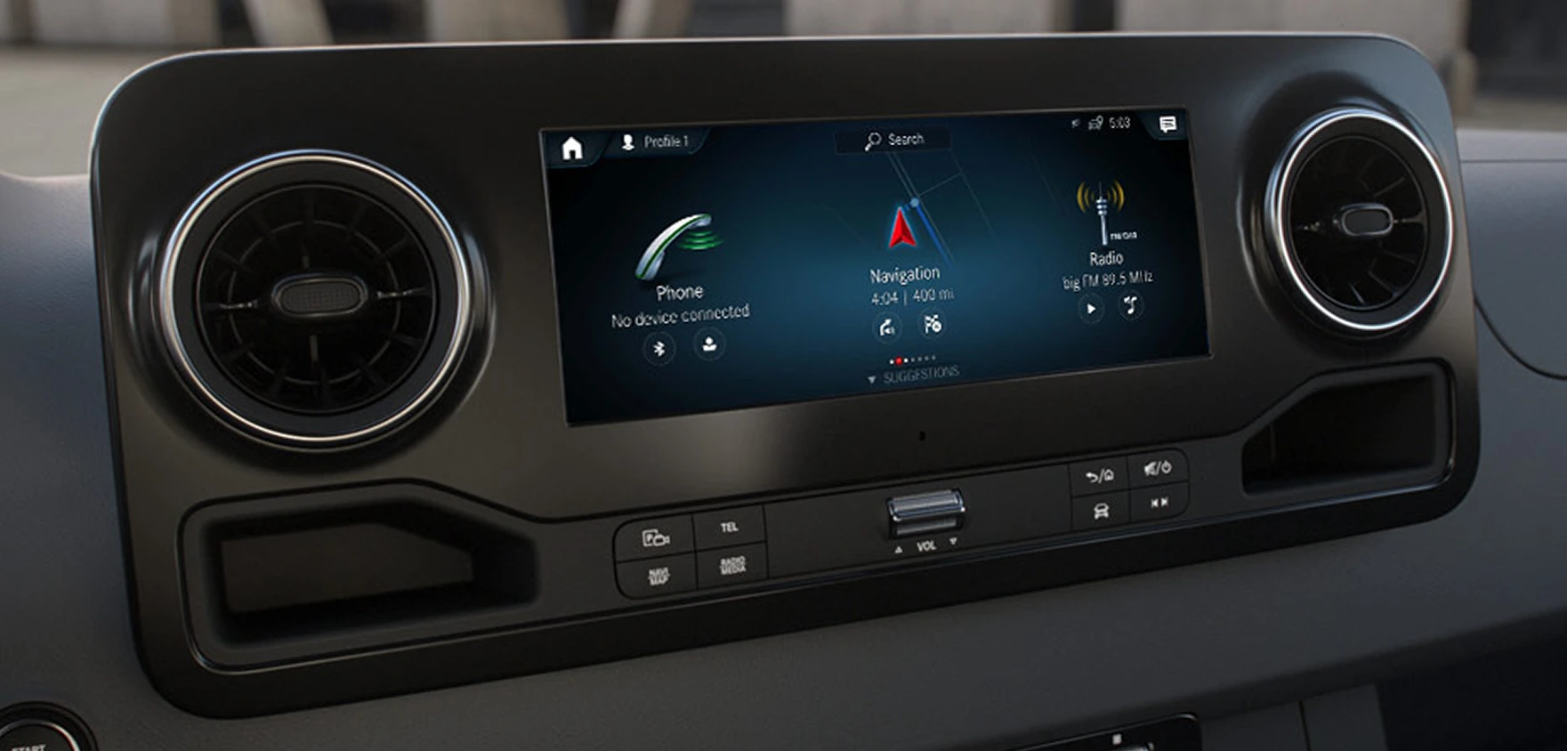 Sprinter dashboard with the 10.25-inch MBUX touchscreen showing phone, navigation and radio tiles between two round air vents