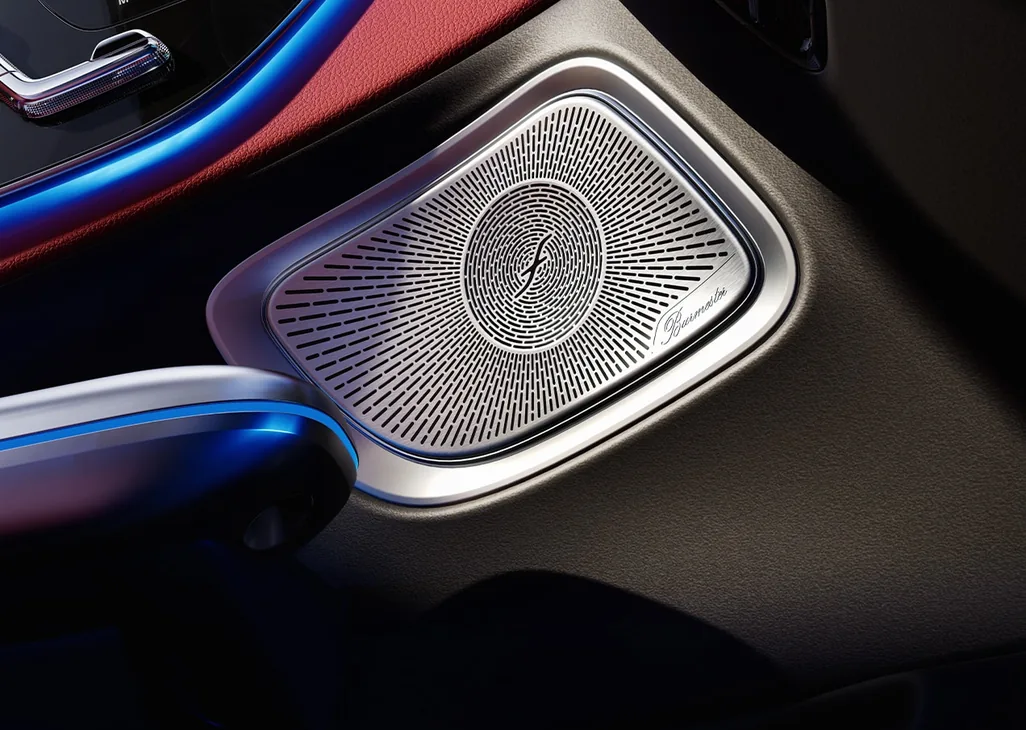 Burmester speaker grille in a CLE door panel with blue ambient lighting