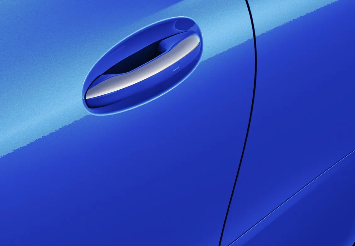 Close-up of the door handle on a bright blue CLE Coupe