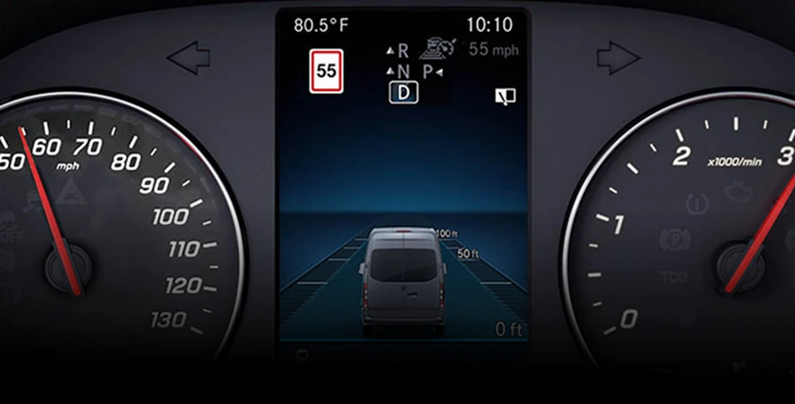 Instrument cluster showing a 55 mph speed-limit sign read by Traffic Sign Assist, between the speedometer and tachometer