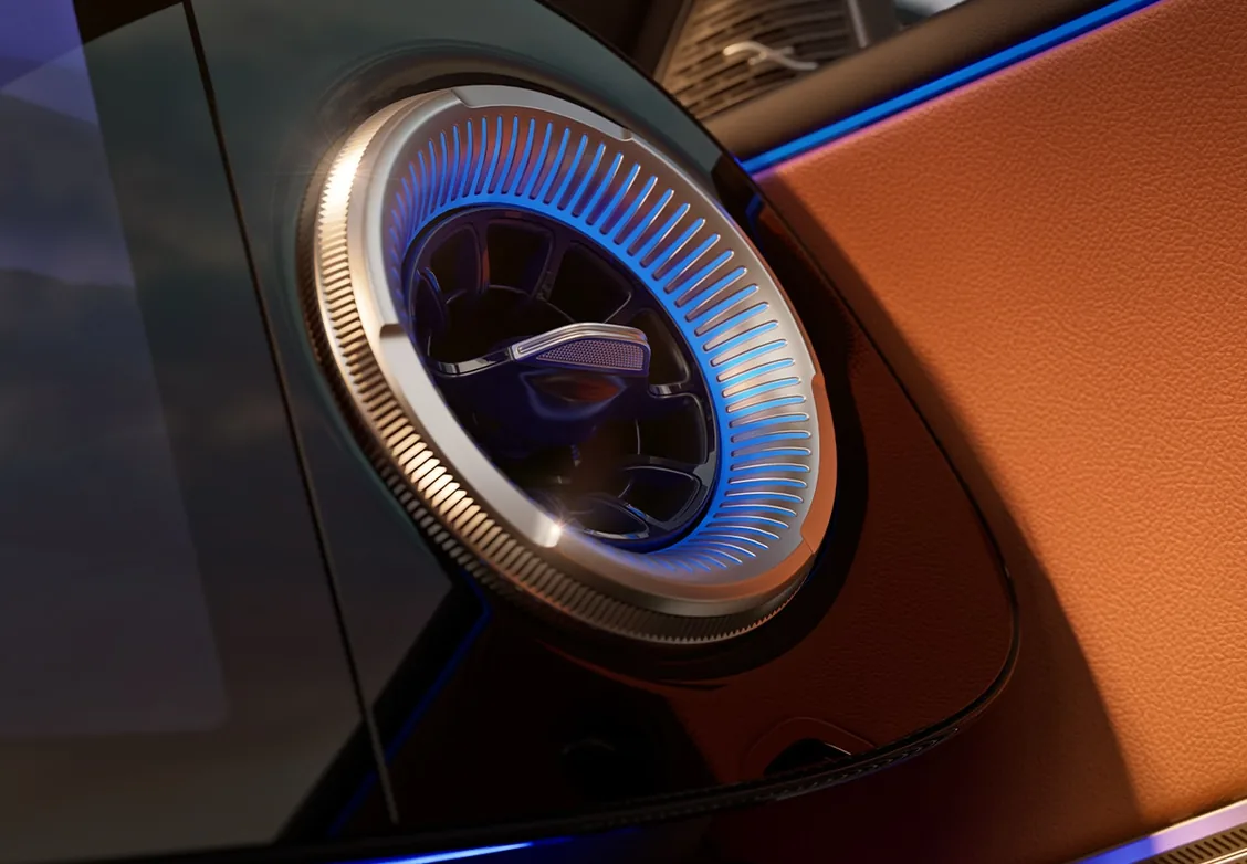 Round air vent glowing blue with ambient lighting against tan trim