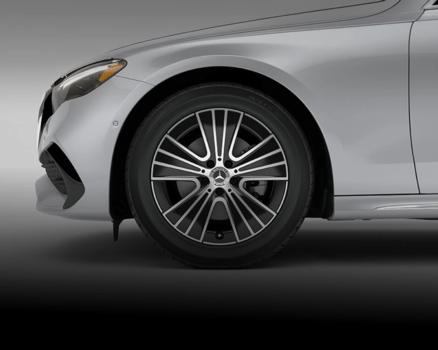 Close-up of an 18-inch five-spoke alloy wheel on a silver E-Class