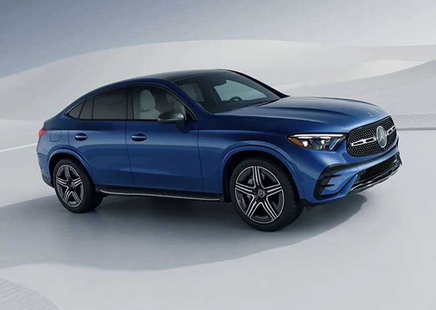Blue GLC Coupe with AMG Line styling in a white studio