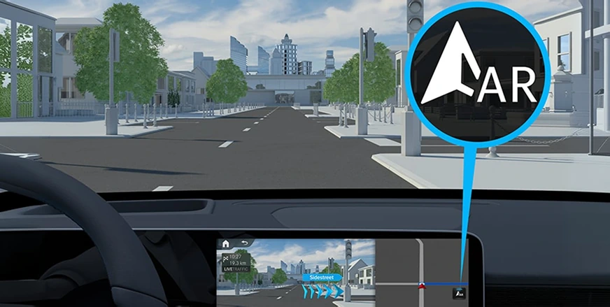 Driver view of MBUX Augmented Video navigation overlaying an AR arrow on a live street view