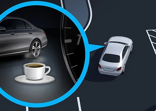 Illustration of ATTENTION ASSIST showing a coffee cup alert beside an E-Class
