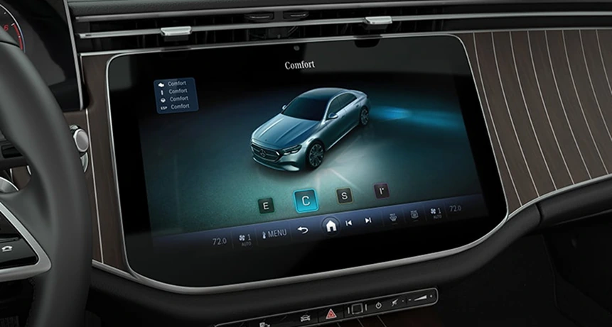 E-Class touchscreen showing the DYNAMIC SELECT drive program menu beside black ash wood trim