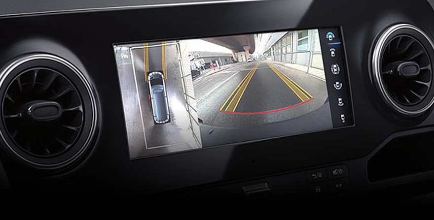 Sprinter centre display showing the 360-degree camera view with an overhead vehicle graphic beside the rear camera feed