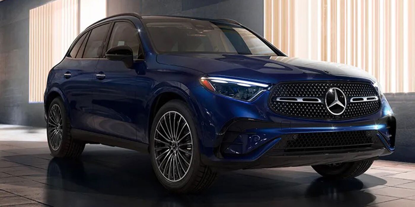 2026 Mercedes-Benz Trim Comparisons 2026 Mercedes-Benz GLC in a dark showroom