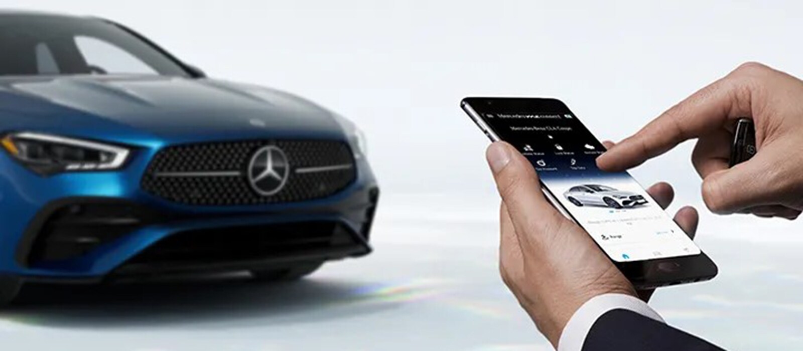 2026 Mercedes-Benz CLA 250 Trim Comparison Driver controlling his new mercedes-benz with a smartphone