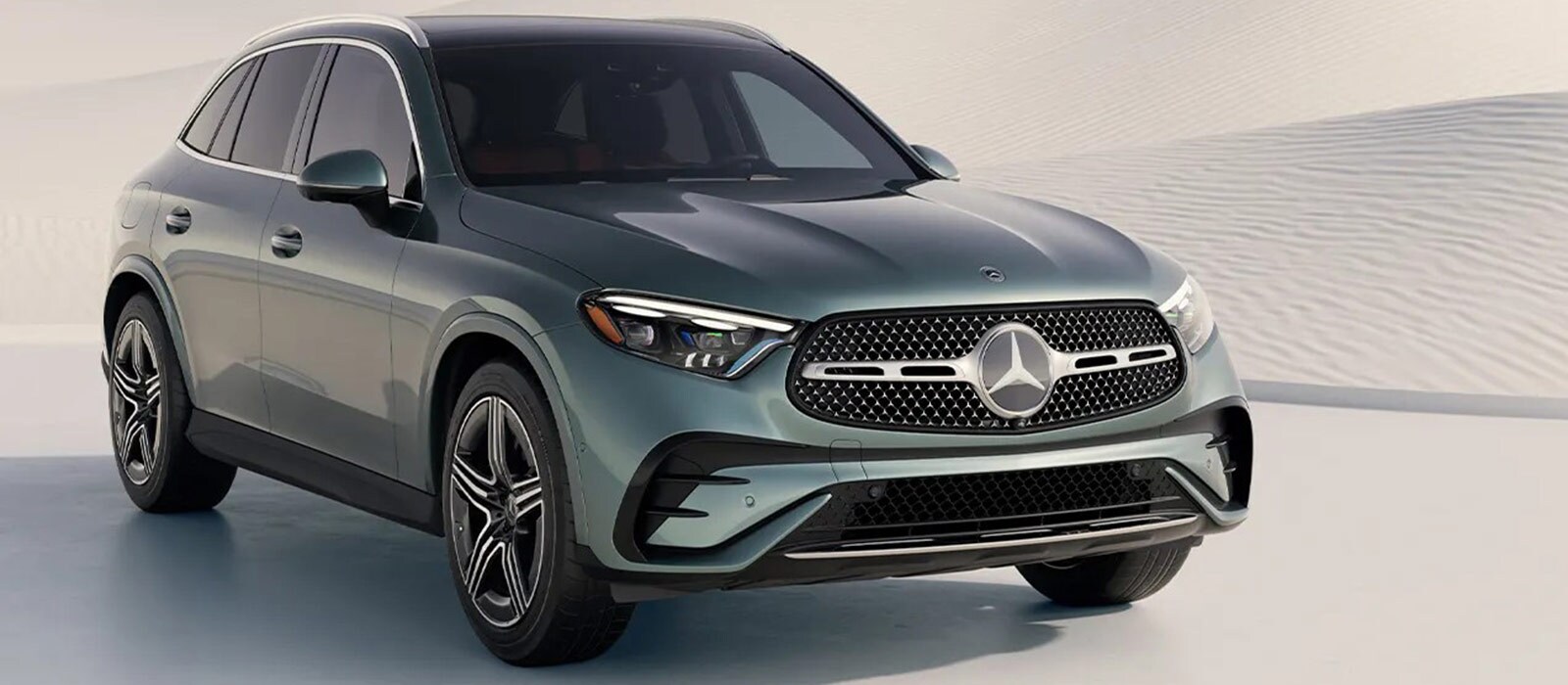 2026 Mercedes-Benz GLC 300 Trim Comparison 2026 Mercedes-Benz GLC parked on a white sand dune