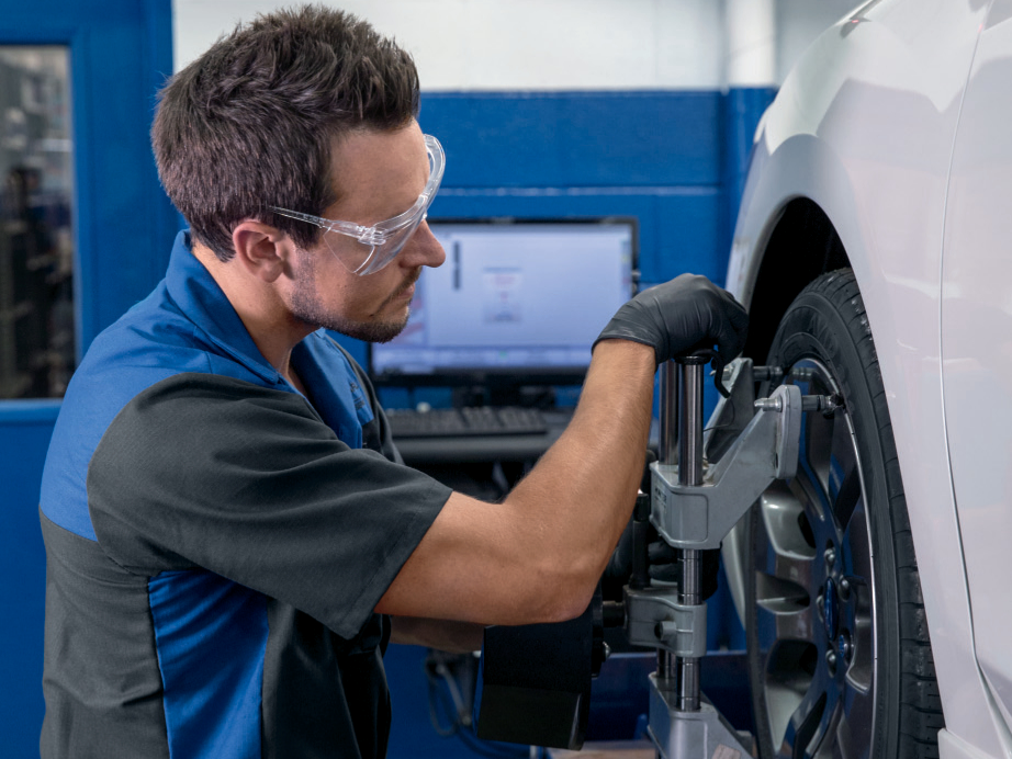 Subaru Tires Subaru service staff aligning a tire