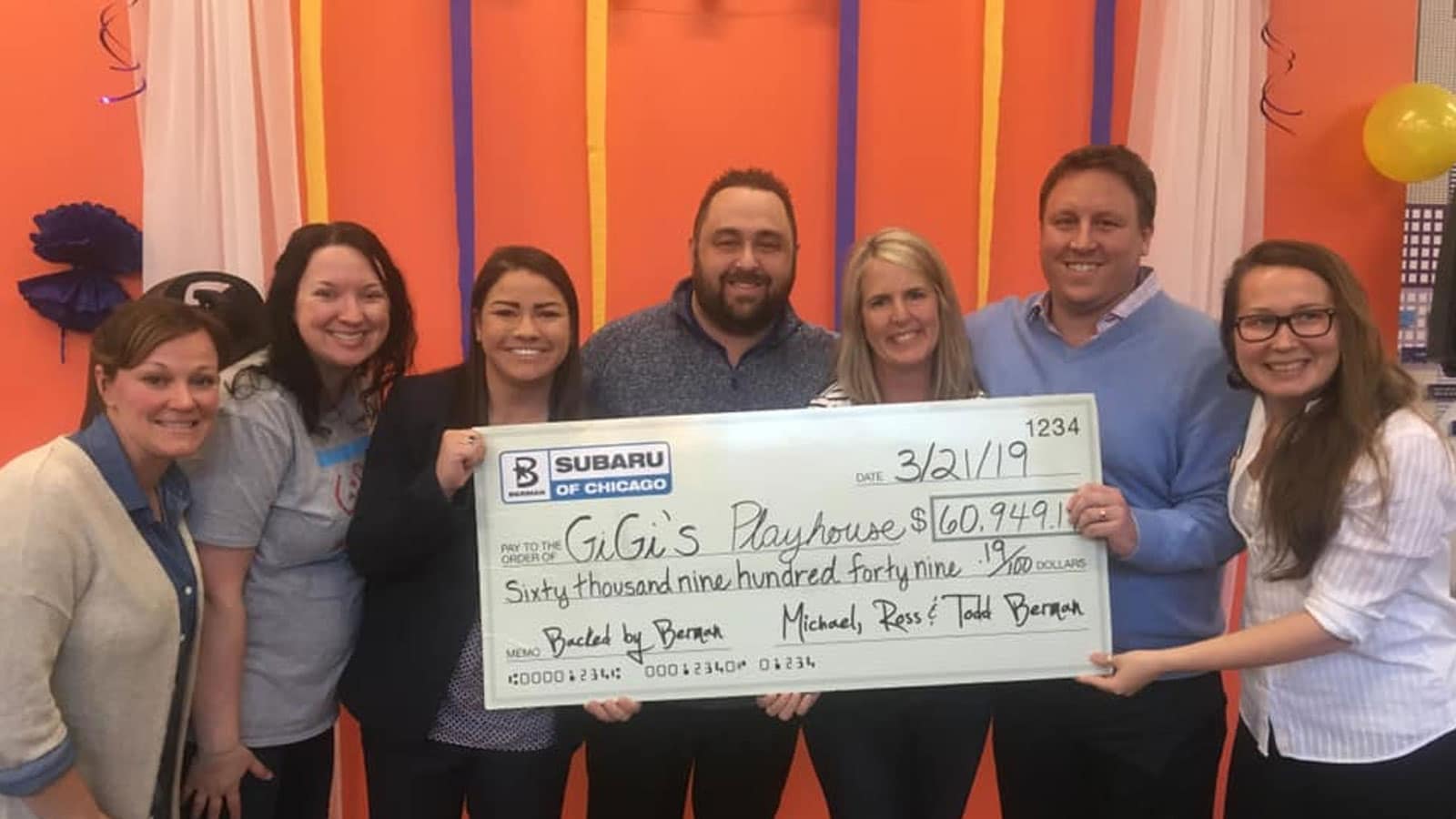 Berman Subaru check presentation to Gigi's Playhouse for Subaru Share the Love event