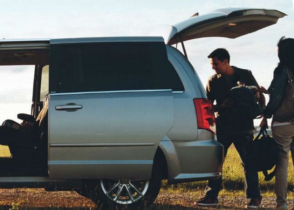 Dodge Caravan unloading Midway Dodge